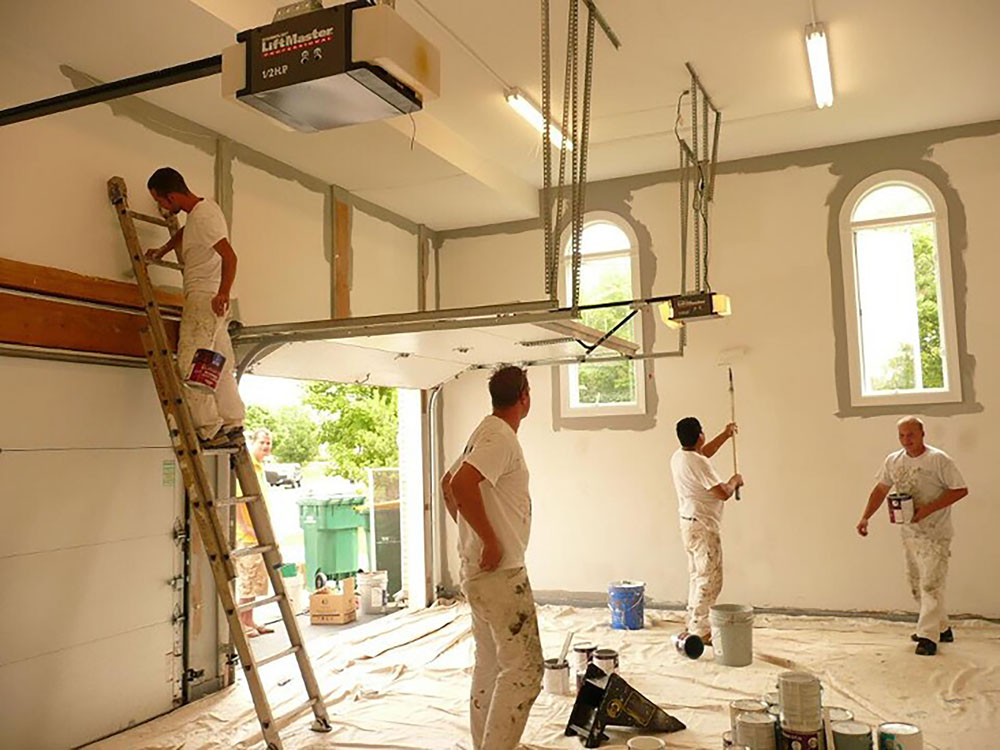 painters painting a large residential garage