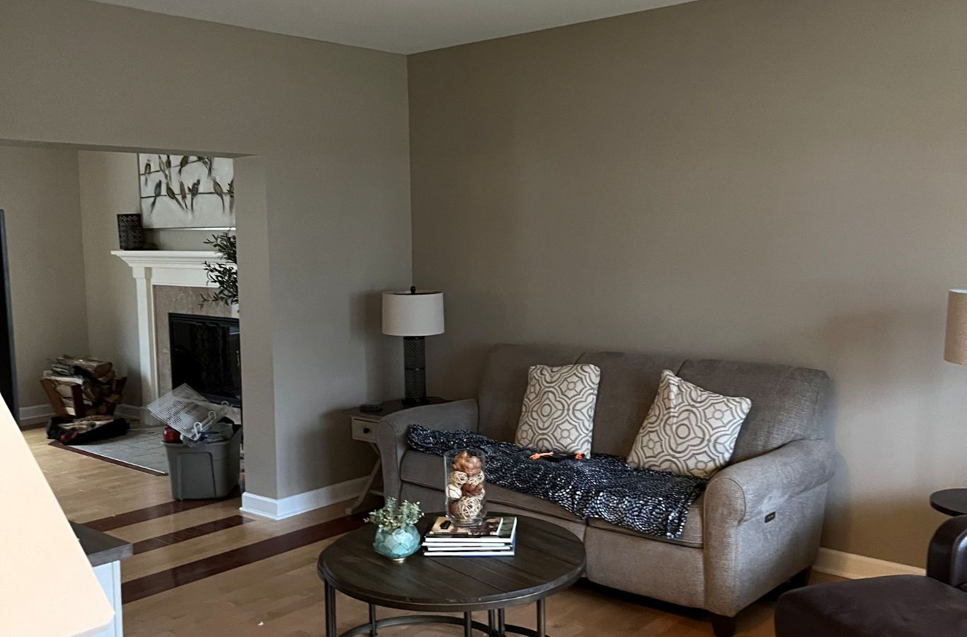 A satisfied customer admiring their newly painted home, highlighting why to choose R&J Painting LLC for painting services in Cook County, IL. Painting Services Near Me.