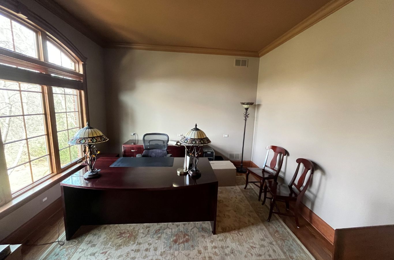 A skilled R&J Painting expert painting a home in Woodstock, IL, highlighting our commitment to quality service. House Painting Near Me.