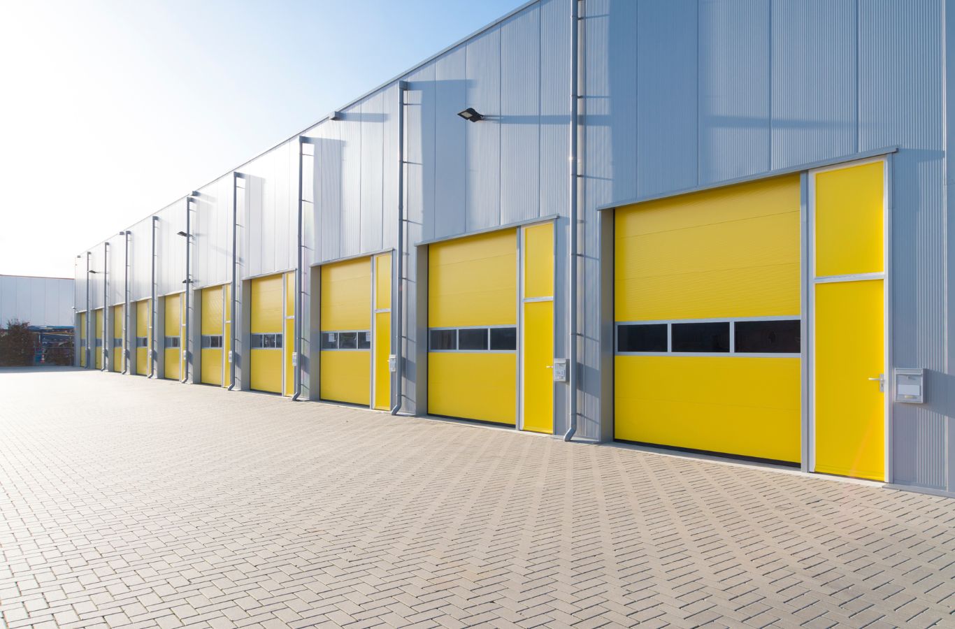 An R&J Painting professional applying paint to a commercial building in Cary, IL, ensuring a clean, precise, and high-quality finish.