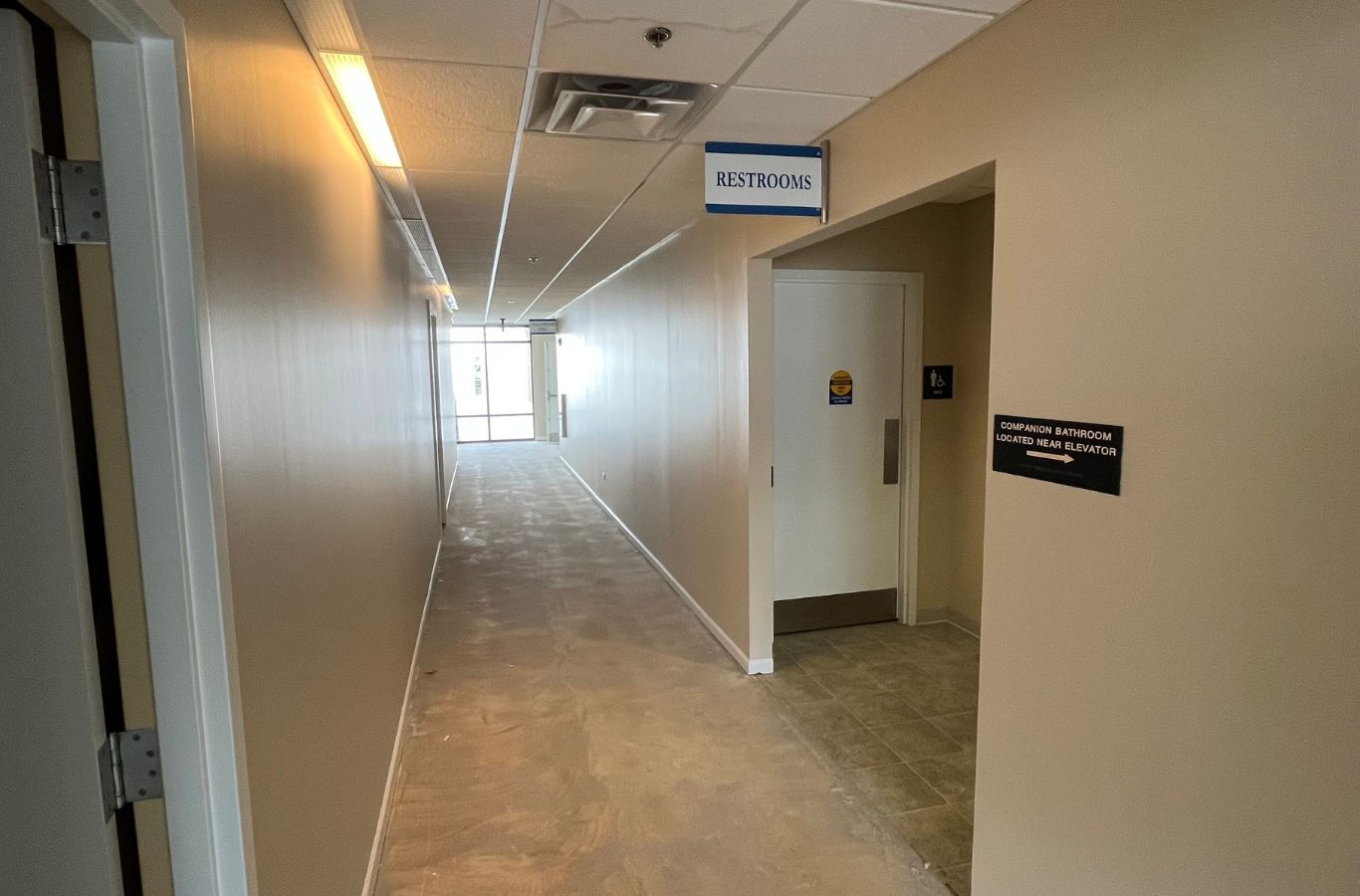 An experienced R&J Painting contractor consulting with a business owner in Cary, IL, ensuring top-quality commercial painting solutions tailored to their needs. Commercial Painting Contractor near me.