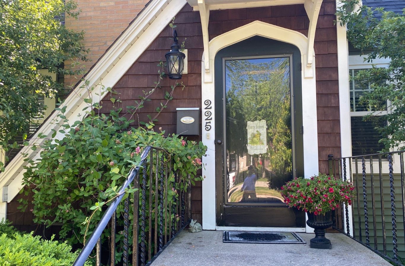 A dedicated R&J Painting team member performing exterior painting on a home in Crystal Lake, IL, highlighting professional techniques and tools.